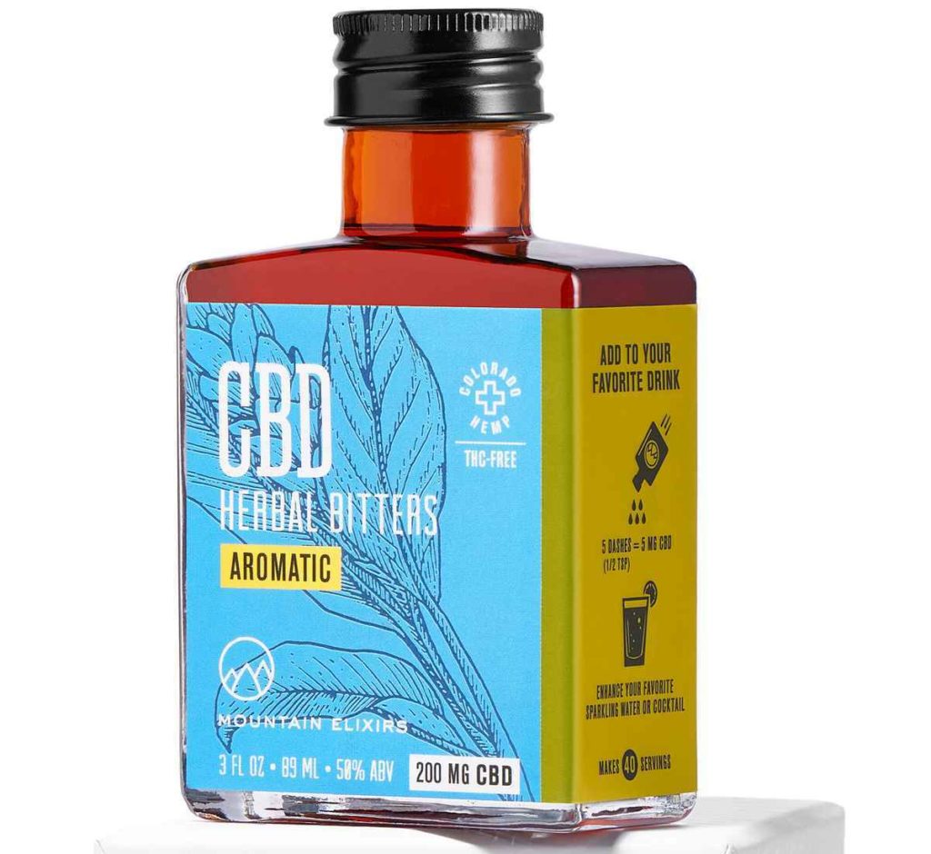 Amber jar of Mountain Elixirs Aromatic CBD bitters with blue and yellow label.
