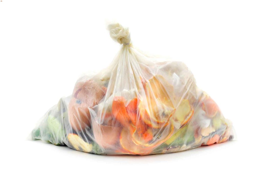 Single garbage bag filled with food scraps.