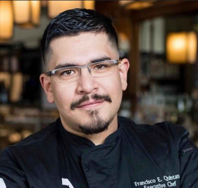 Photo of Francisco Quintana wearing black chef's coat.