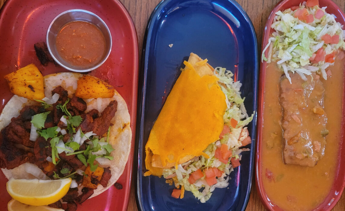 colorful plates of tacos and a chile relent