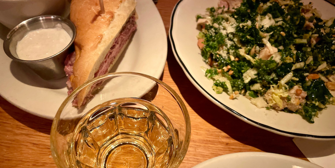 french dip and salad and drink at white house in aspen