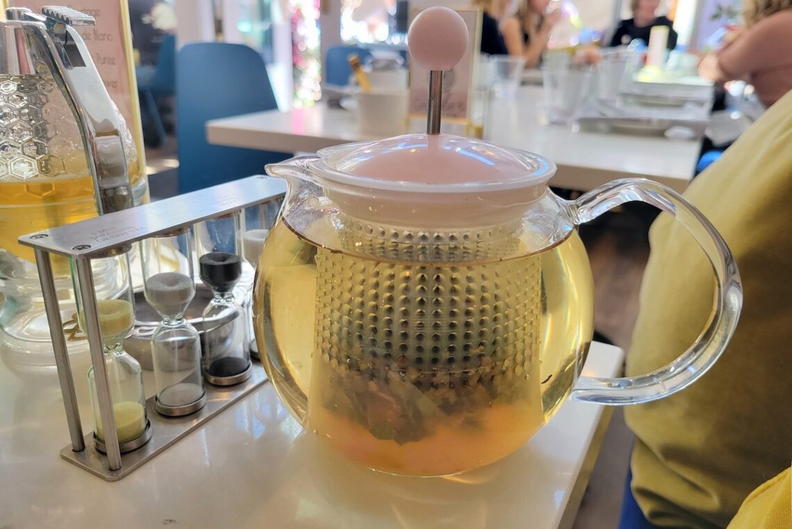 clear tea pot on table