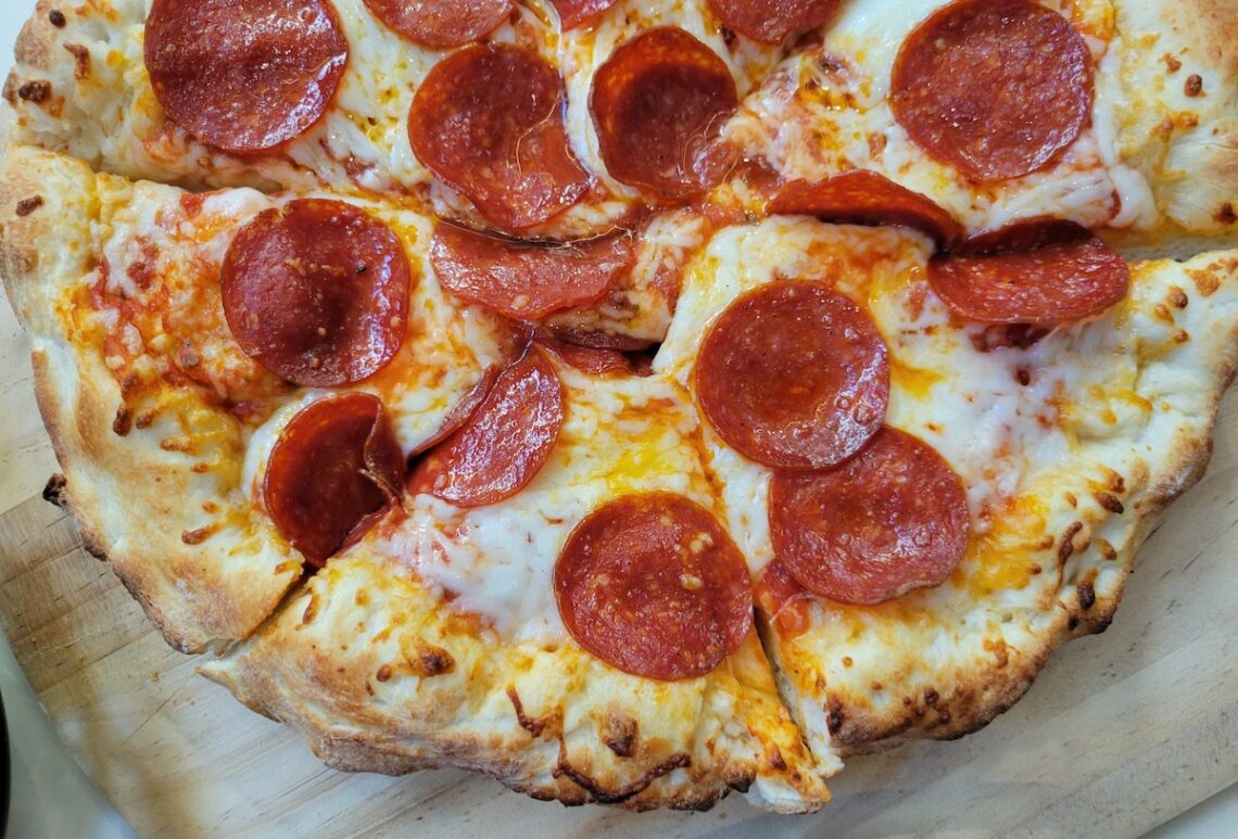 half a pepperoni pizza sliced