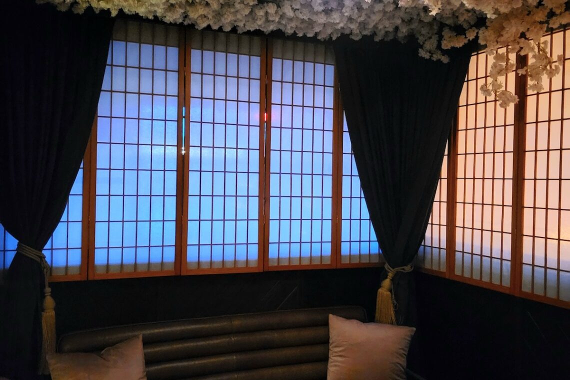 blue windows with curtain and pillow