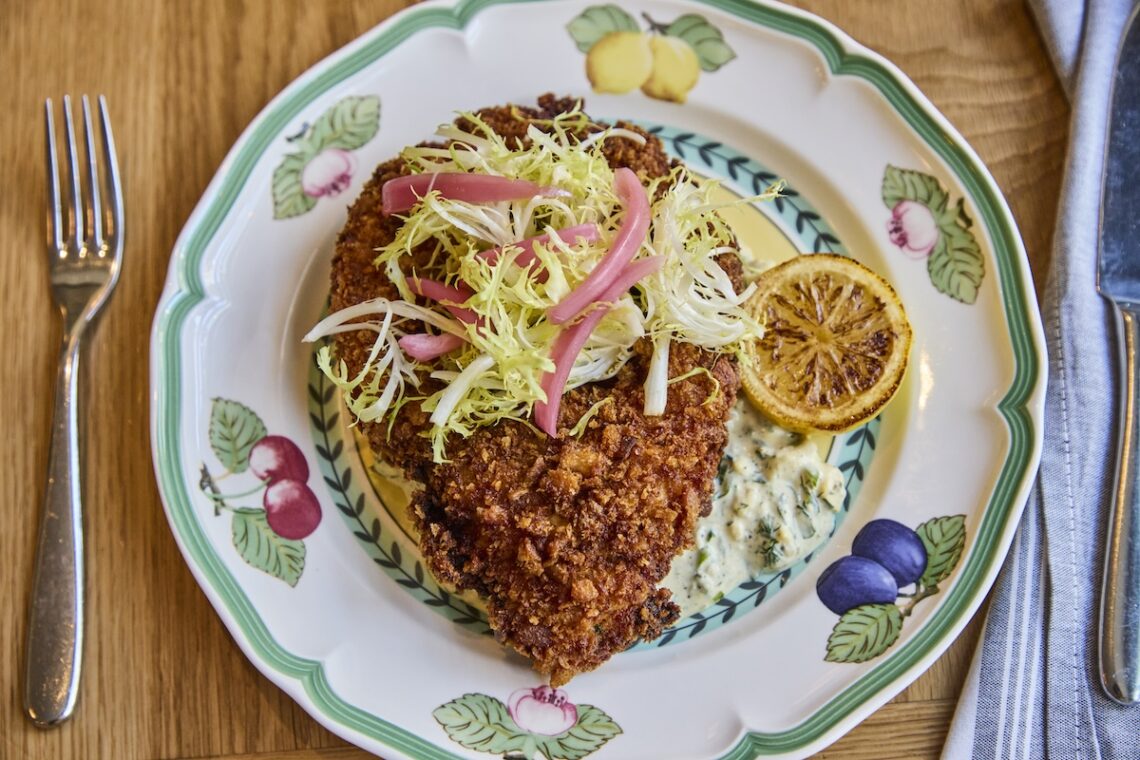 antique plate with fried pork and lemon
