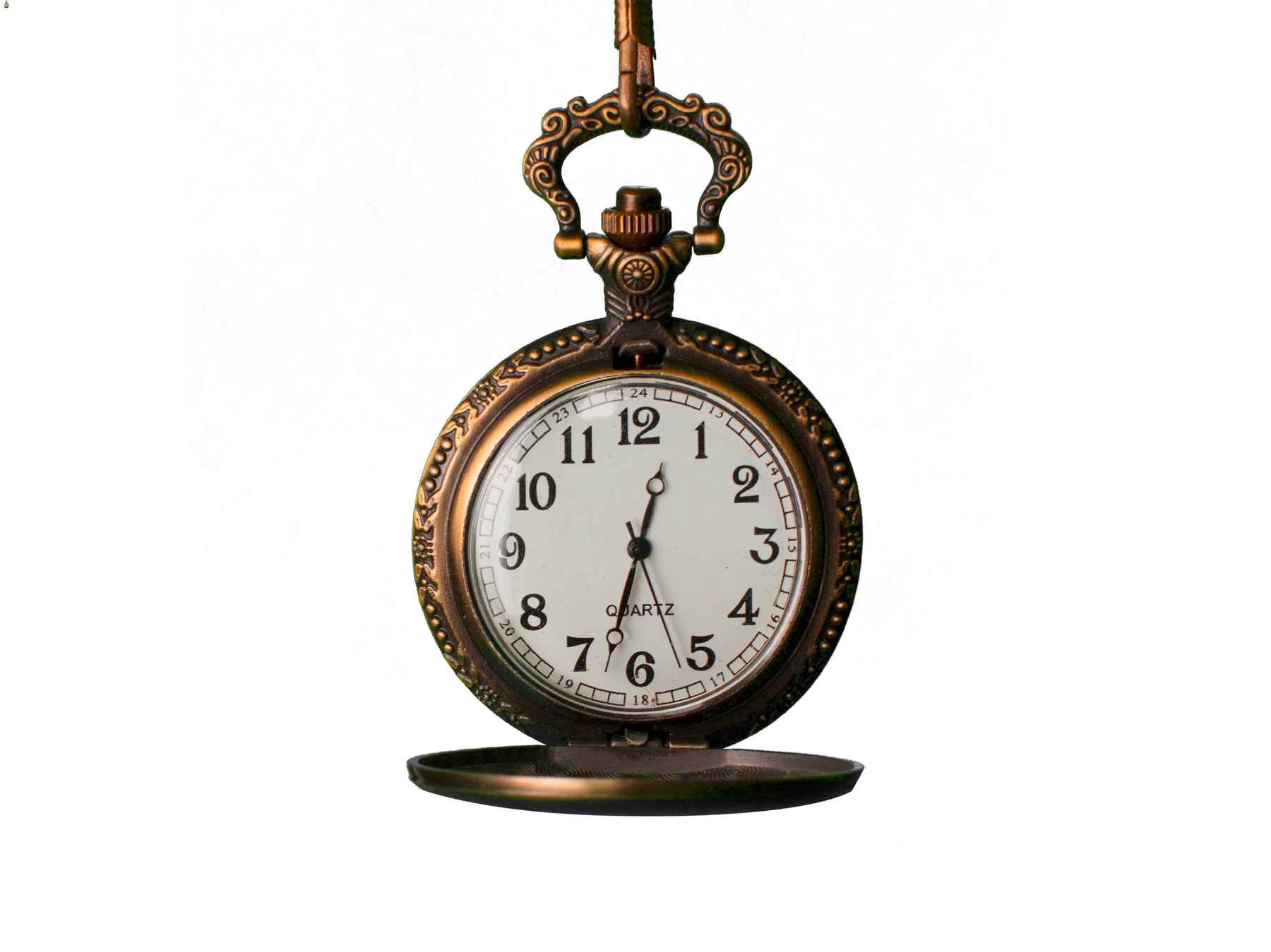 Vintage metal pocket watch hanging on a chain.