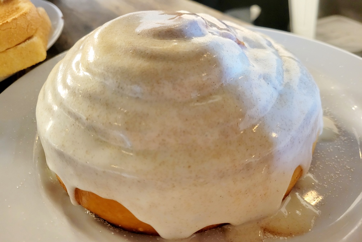 giant cinnamon roll with frosting