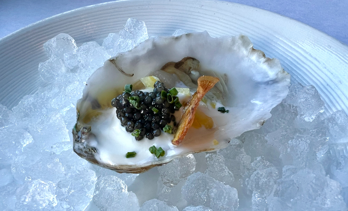 bed of ice with oyster topped with caviar