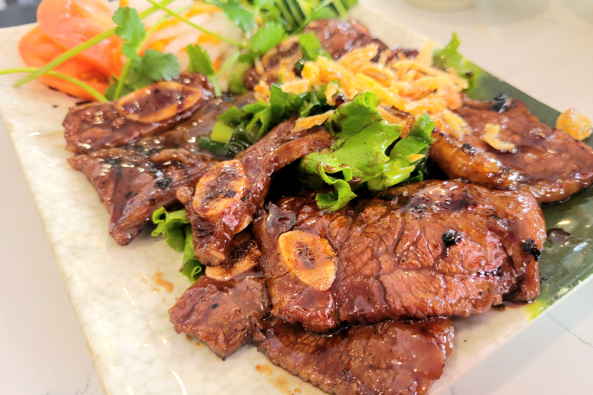 plate of short rib with scallions now pho Vietnamese