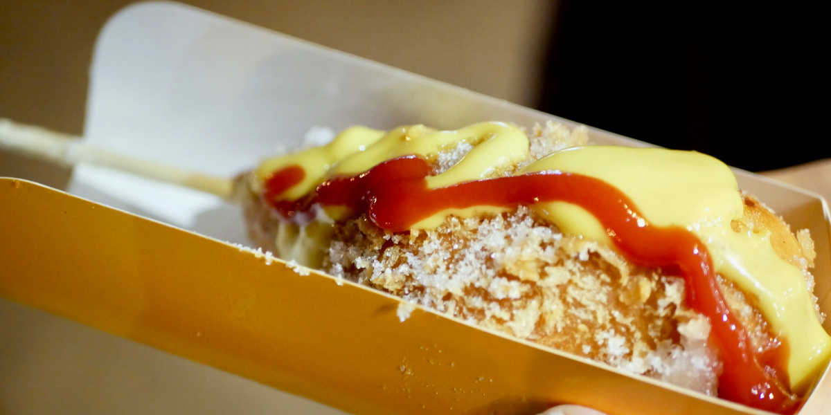 If you want to jump on the next big food trend, you can’t miss out on Korean Hot Dogs. What makes them different? They’re fried in a sweet rice flour batter that makes them crunchier than what we think of with an American corndog. They also come in a variety of exciting and unexpected toppings.