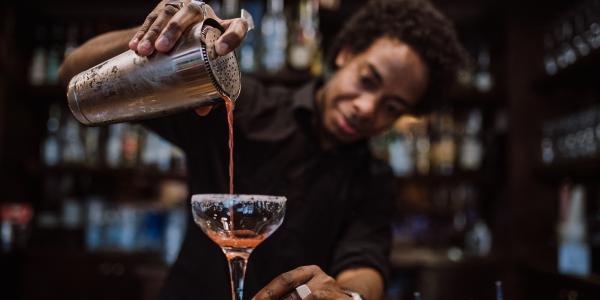 Server pouring cocktail
