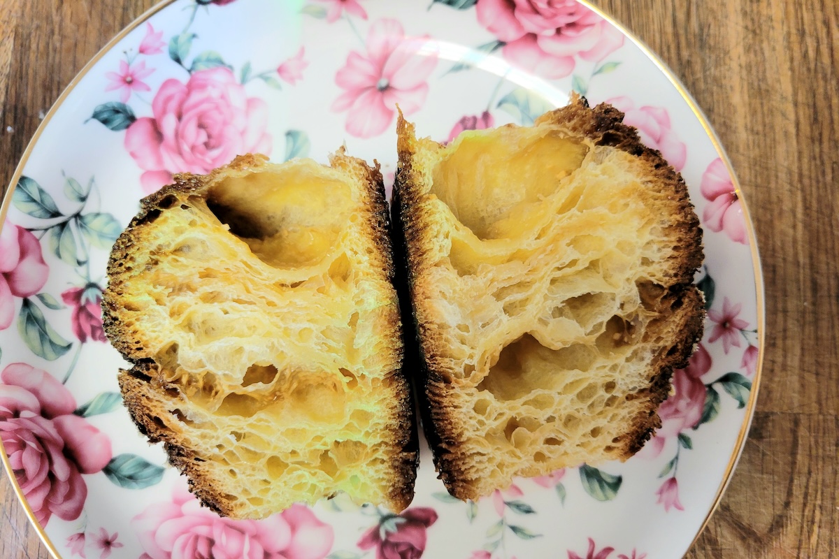 flower plate with pastry cut in half on it