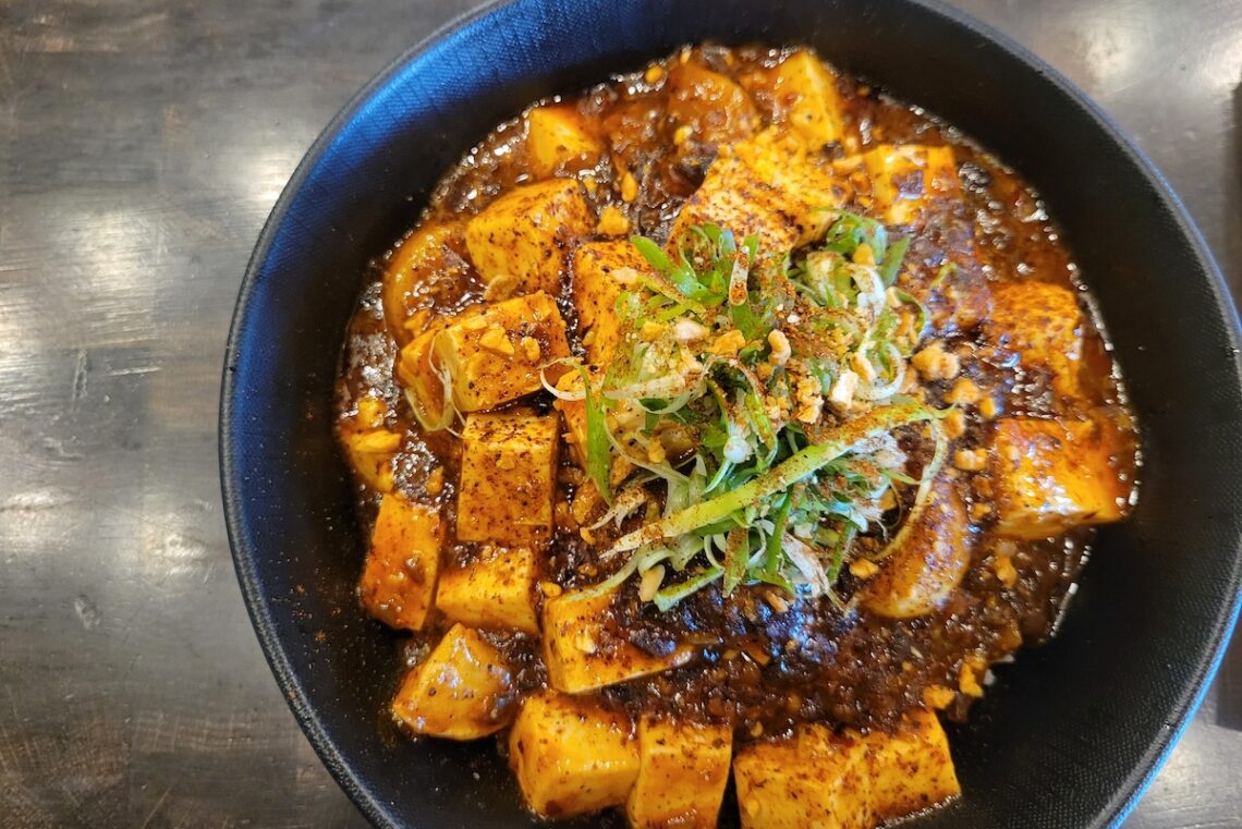 black bowl with spicy tofu