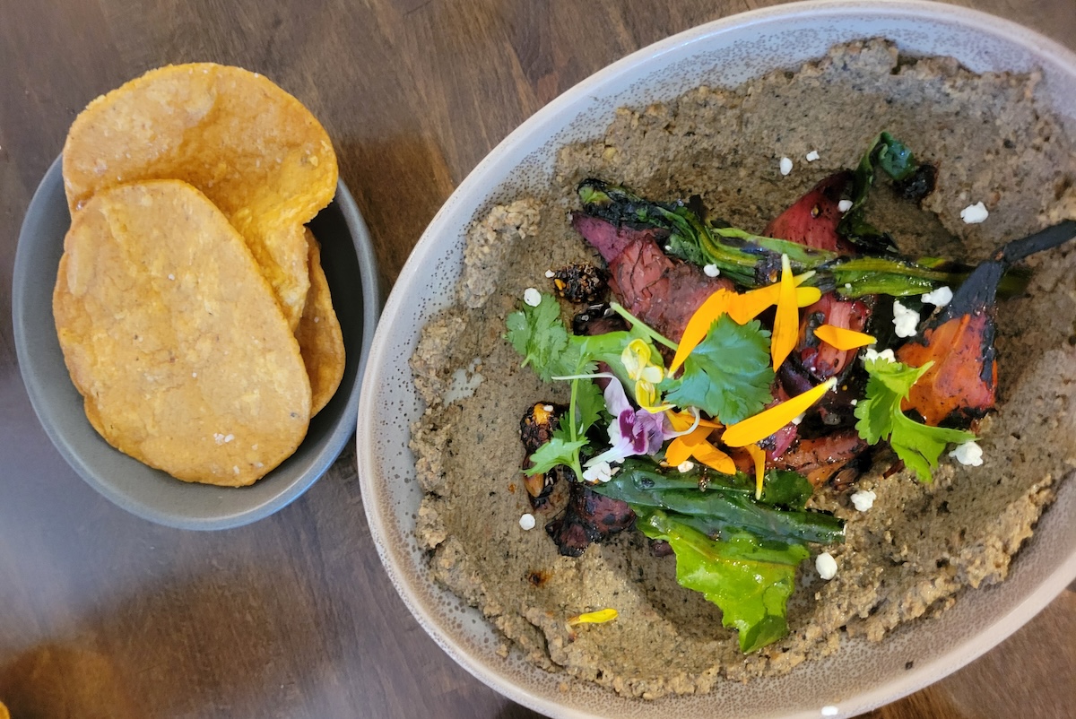 plate with sikil pak and tortillas 