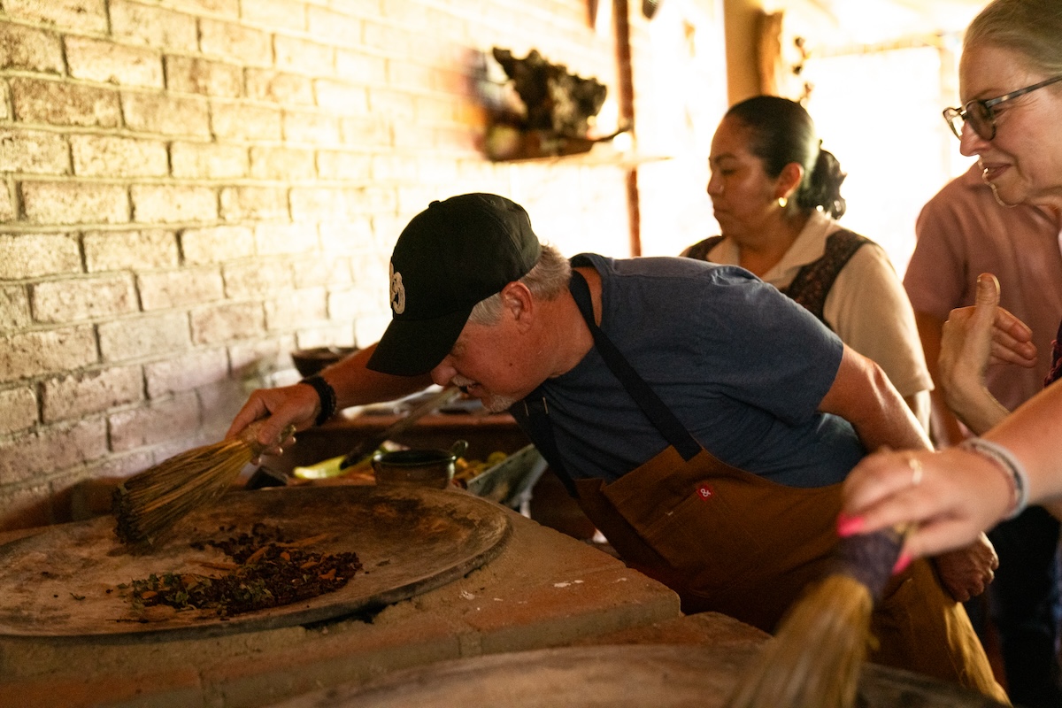 Chef Richard Sandoval works on cooking traditional spices and foods in Oaxaca. | Photo by Richard Sandoval Hospitality