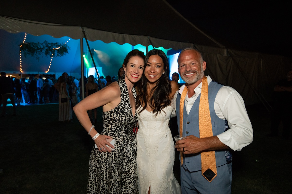 Shalisa (center) and Jeff (right) at their wedding, The Wedding Party. | Photo by DiningOut Events