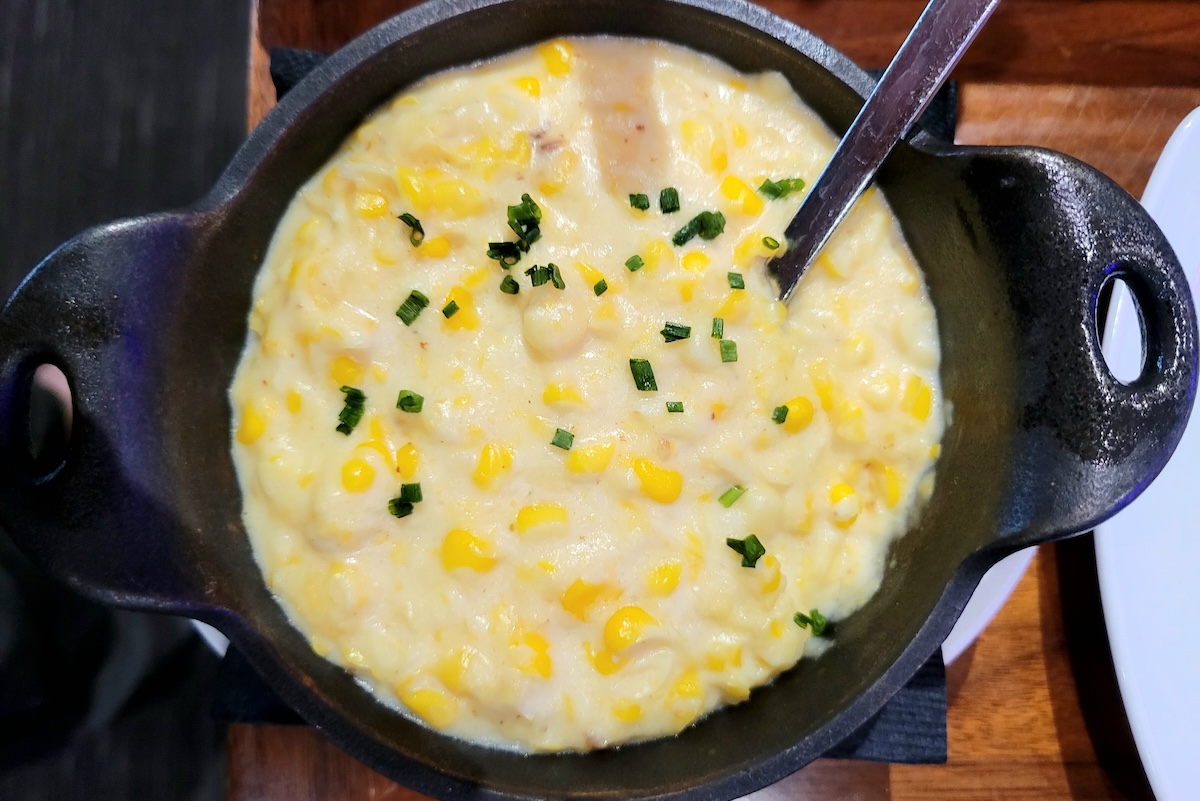 The corn pudding at STK looks simple, but the flavor is deep and satisfying. | Photo by Linnea Covington