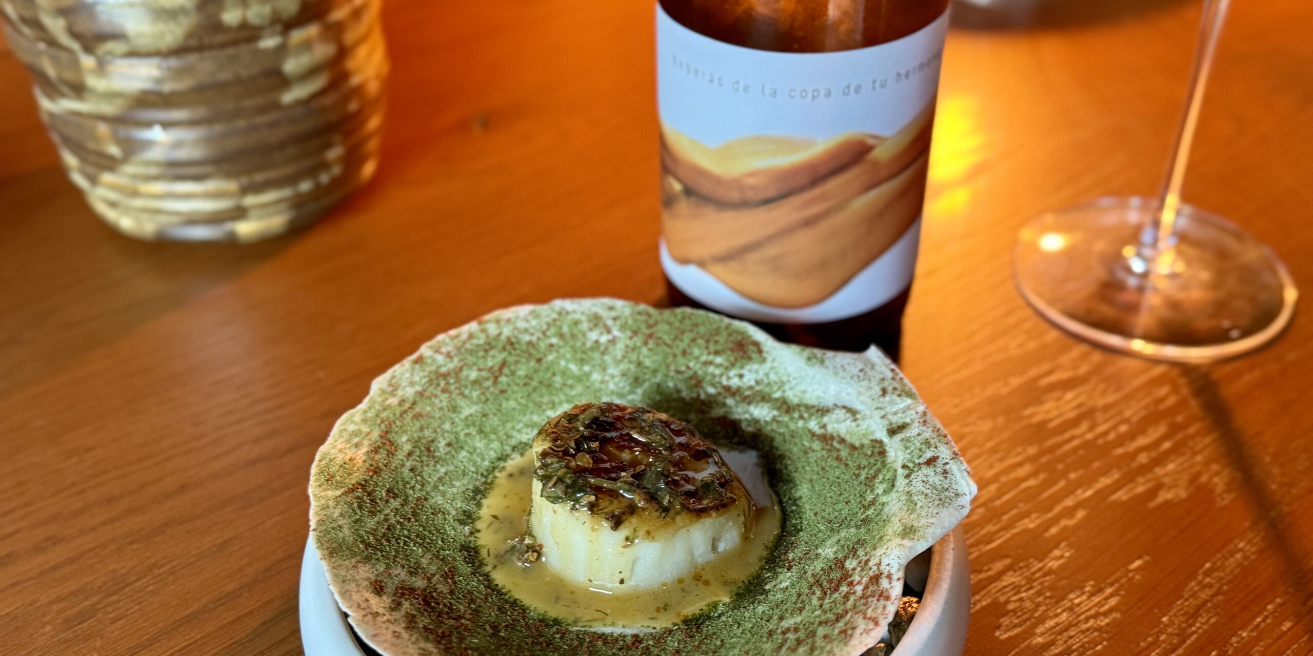 Scallop on the half shell with skin contact white blend from Fil·loxera winery. | Photo by Montana Rae