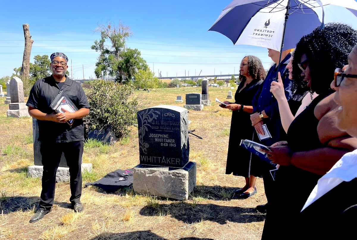 Adrian Miller speaking at the memorial service he prepared for C.B. Hill. | Photo by Rebecca Treon