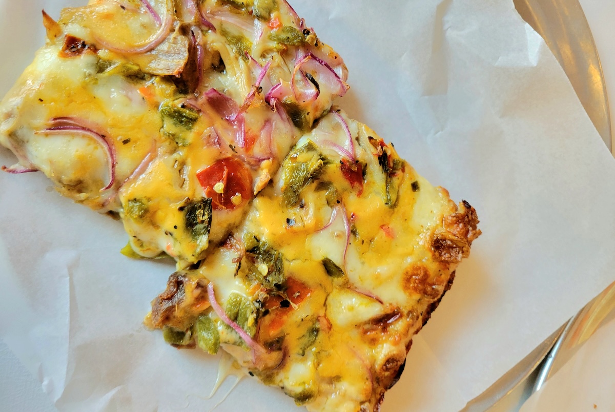 Pork green chile on pizza? Yes please. | Photo by Linnea Covington