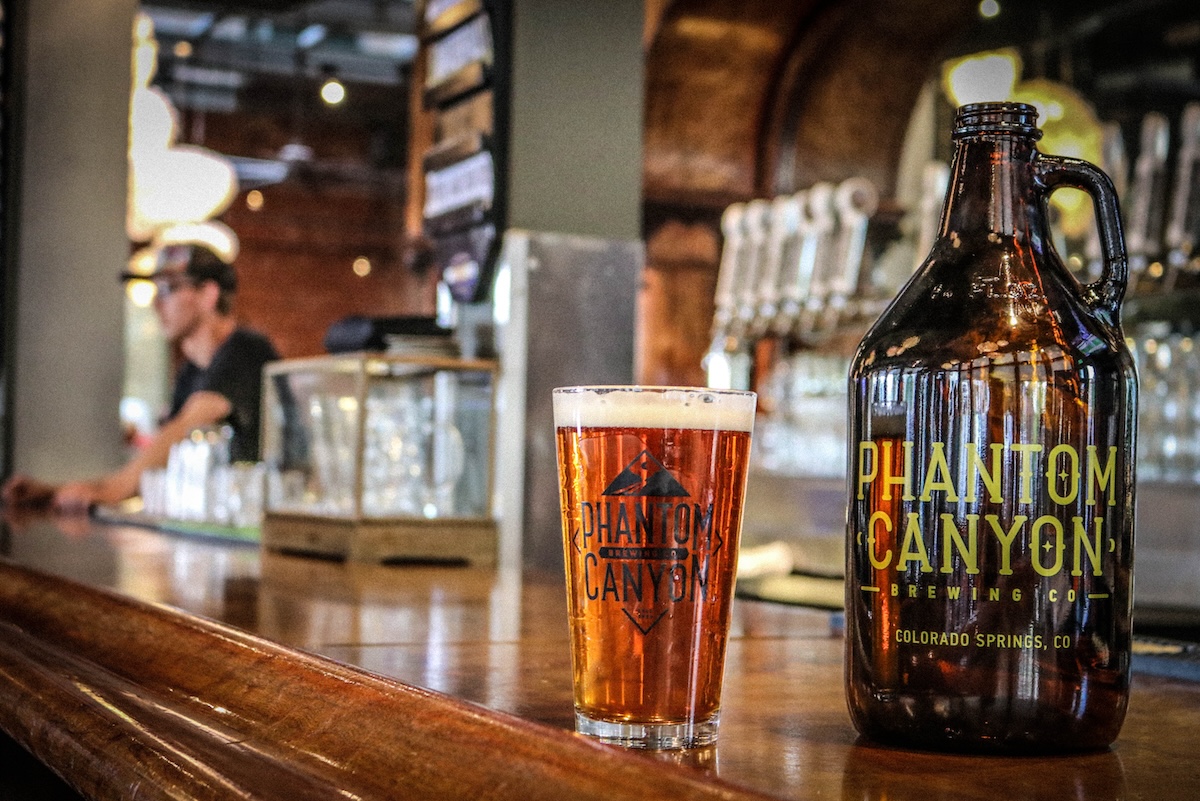 Growler and pint of beer at Phantom Canyon Brewing. | Photo by Breckenridge Wynkoop