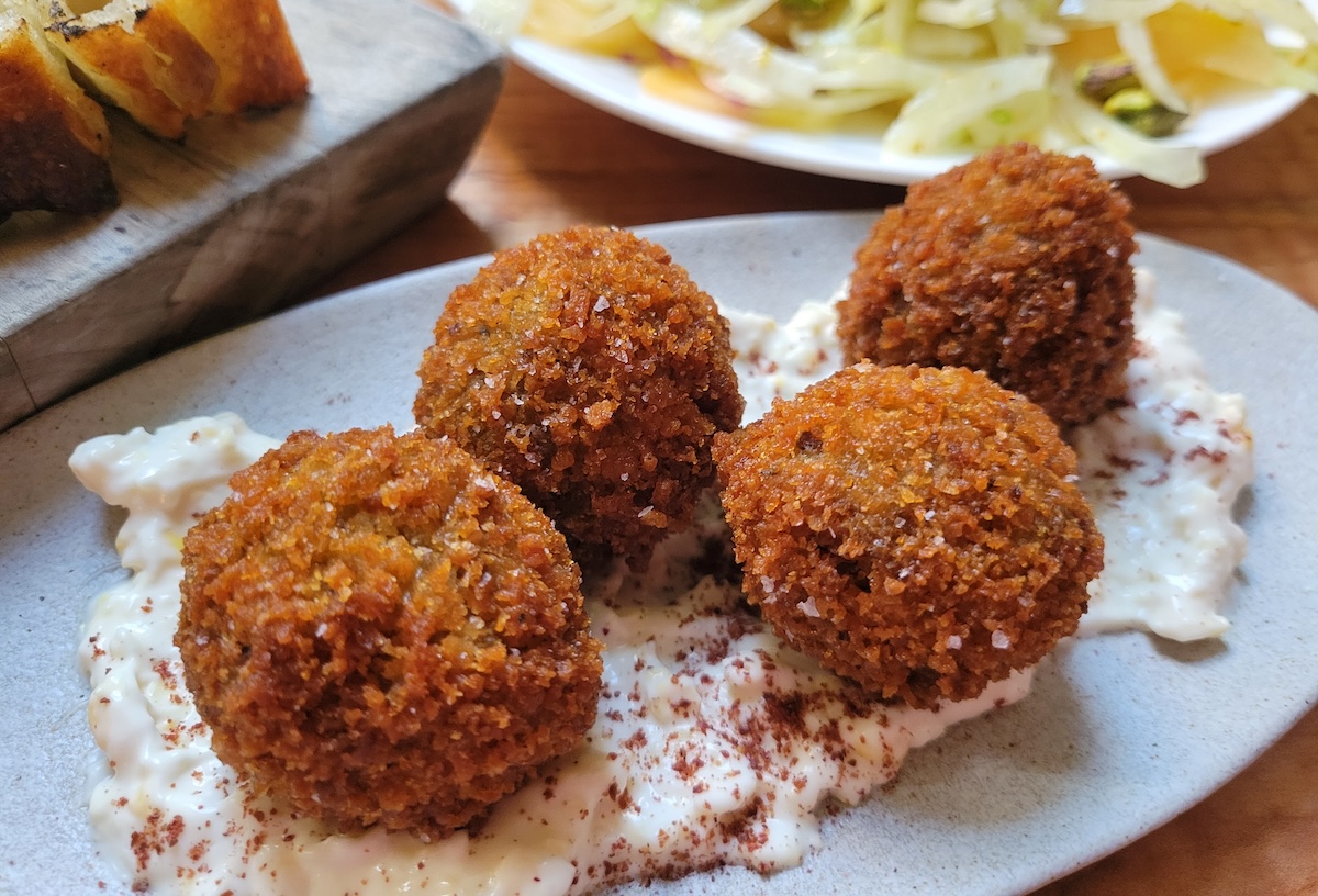 Don't miss out on the vegan arancini at Somebody People. | Photo by Linnea Covington