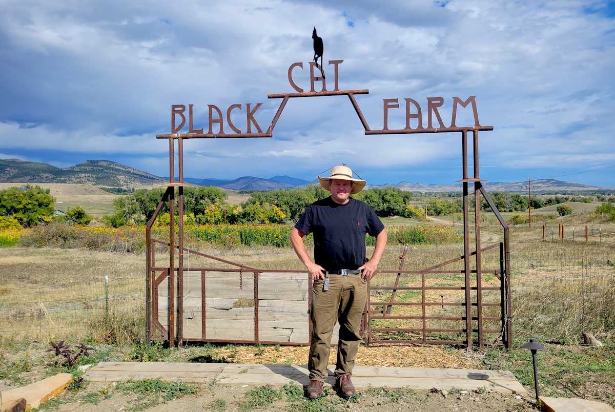 Chef and farmer Eric Skokan at his Black Cat Farm. | Photo by Linnea Covington