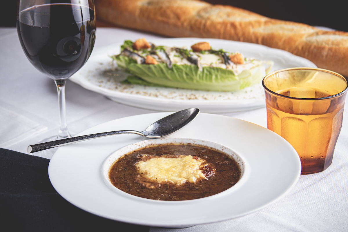 French onion soup and Caesar salad at Etoile. | Photo by Sean Rainier