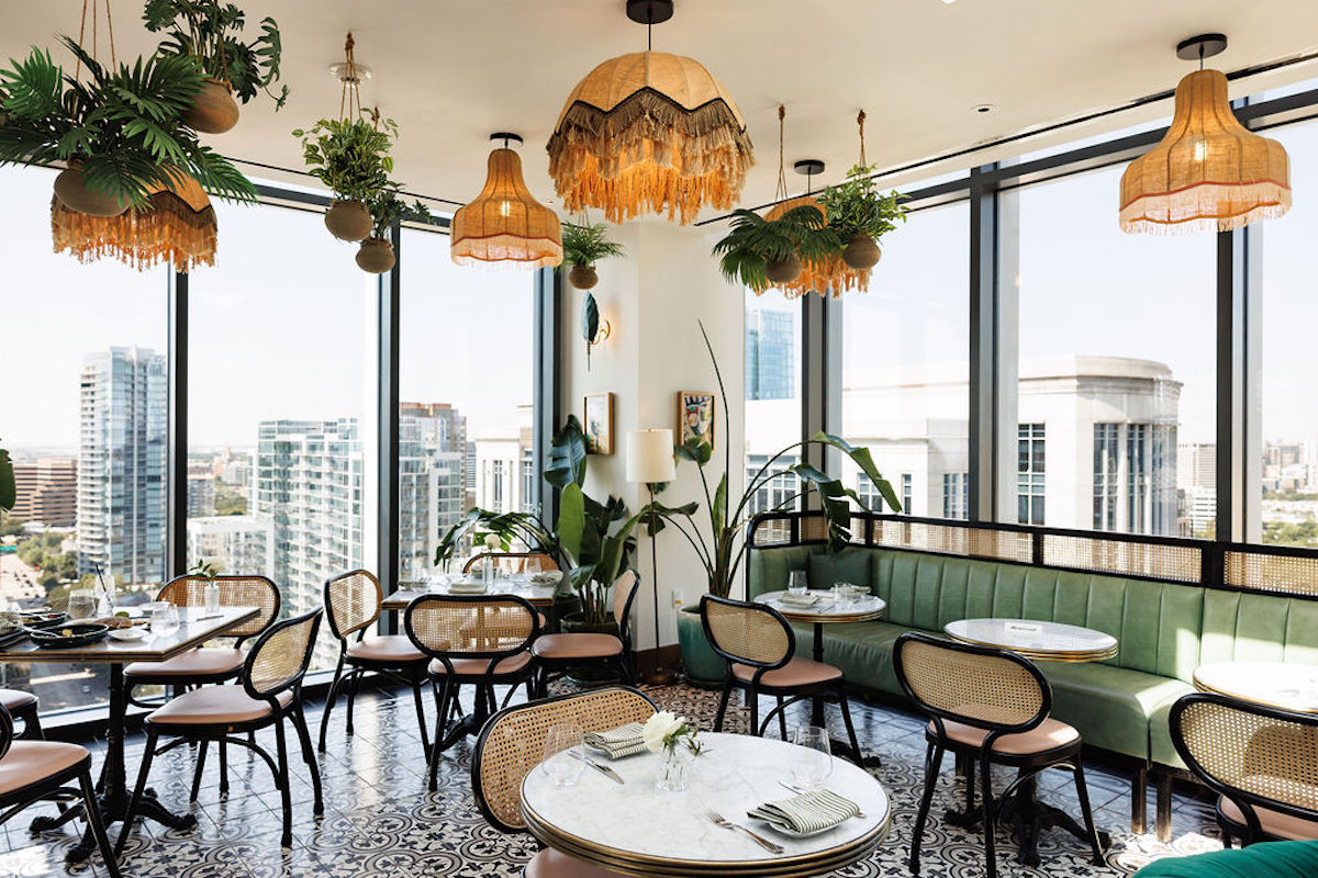 Floor-to-ceiling windows give guests ample city views at Leonie. | Photo by Leonie