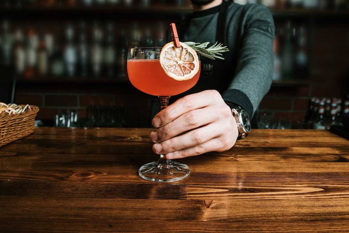 Barman holding a delicious exotic cocktail ID 155468131 by wirestock stock image mocktail dry january