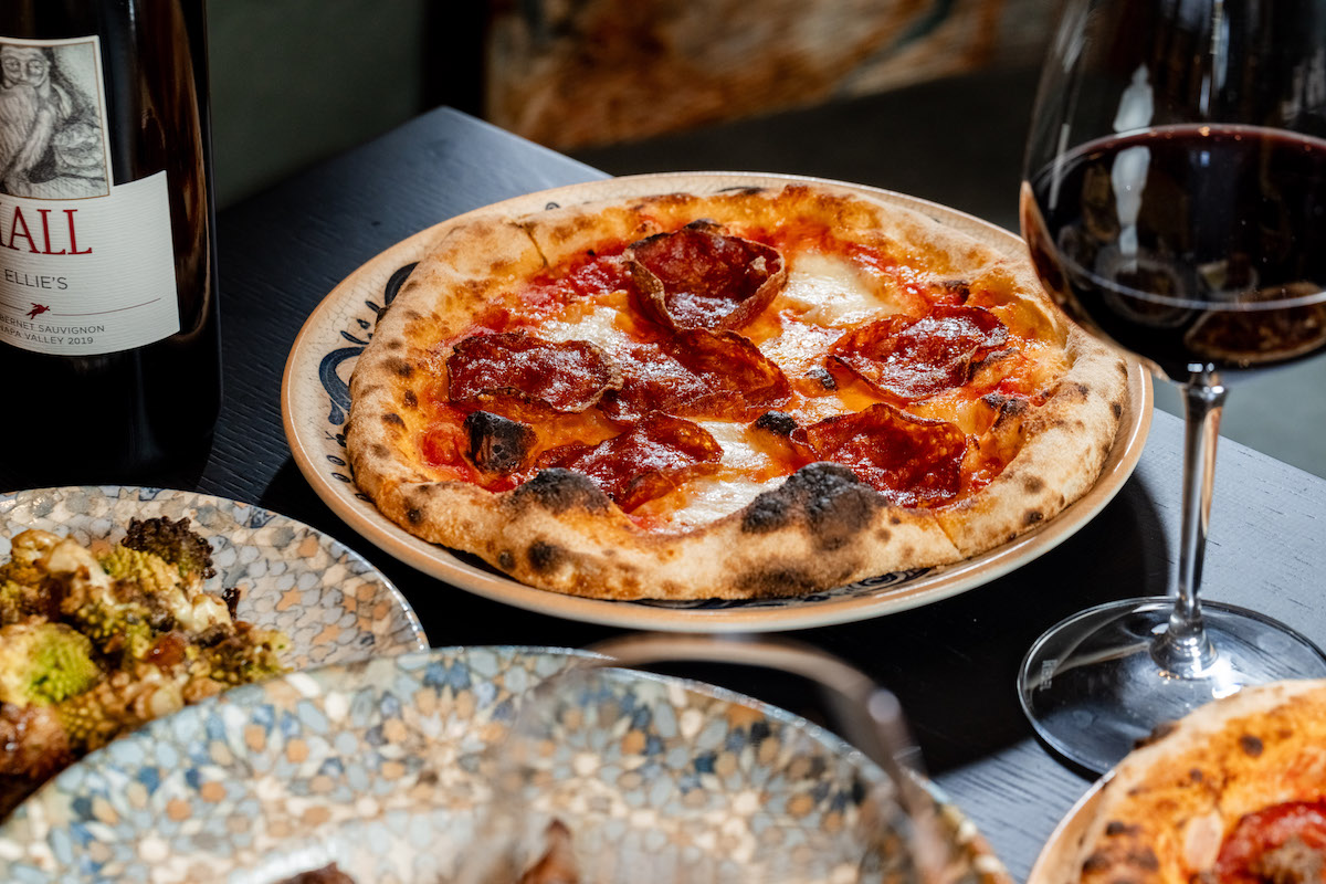 A pairing of pepperoni pizza and red wine at Palato. | Photo by HALL Park Hotel