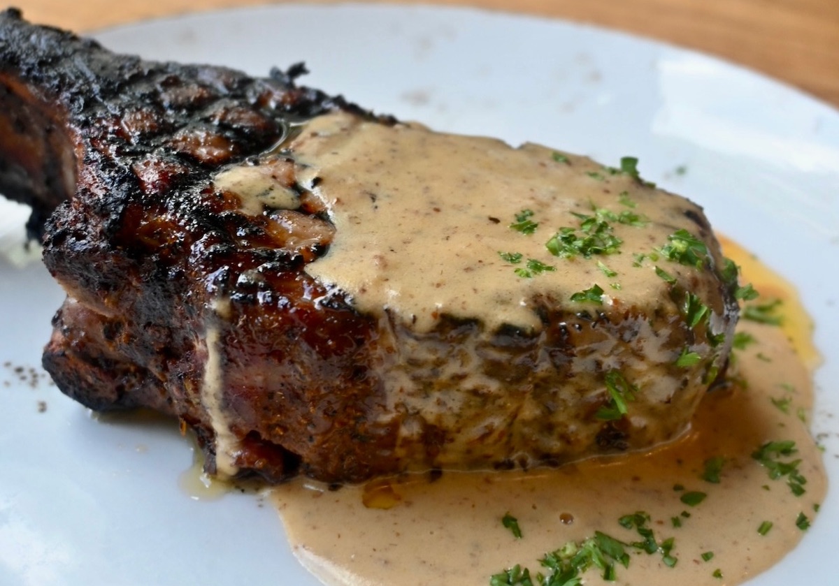 Pork chop at Cork and Pig Tavern. | Photo by Cork and Pig Tavern