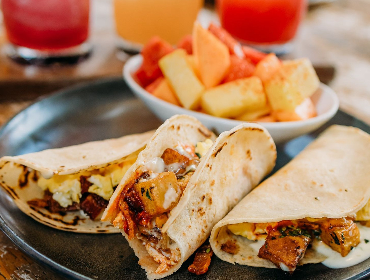 Breakfast tacos with fruit and cocktails at Mexican Sugar. | Photo by Mexican Sugar