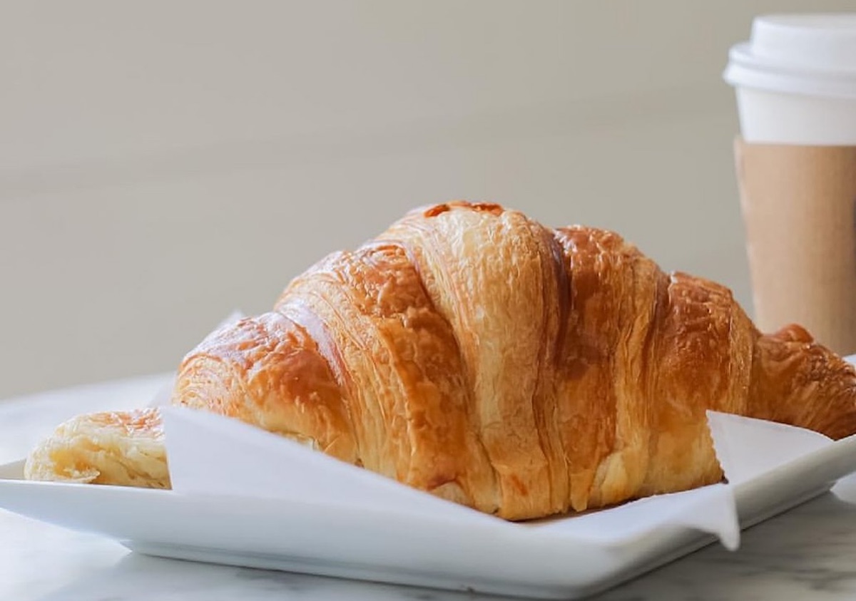 Croissant and coffee at Village Baking Co. | Photo by Village Baking Co.
