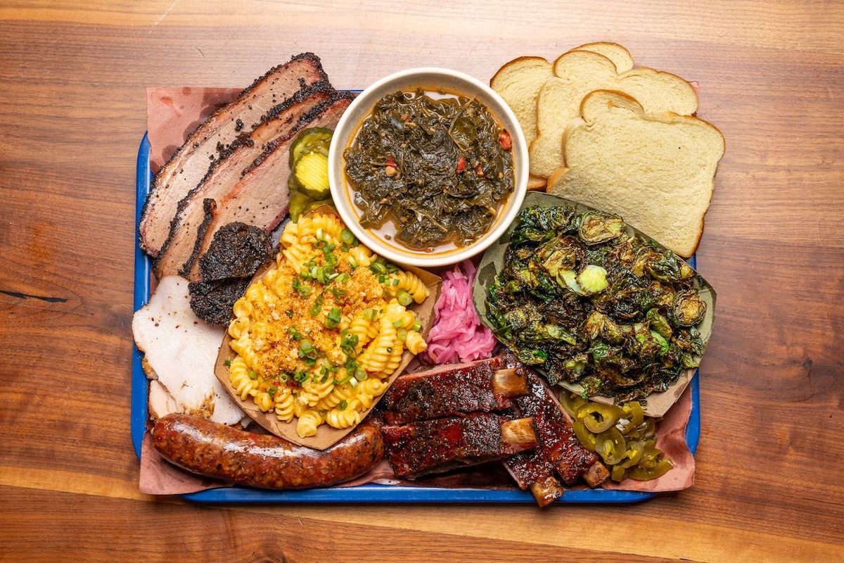 A hefty sampling of smoked meats, sides, and bread at Feges BBQ. | Photo by Carla Gomez 
