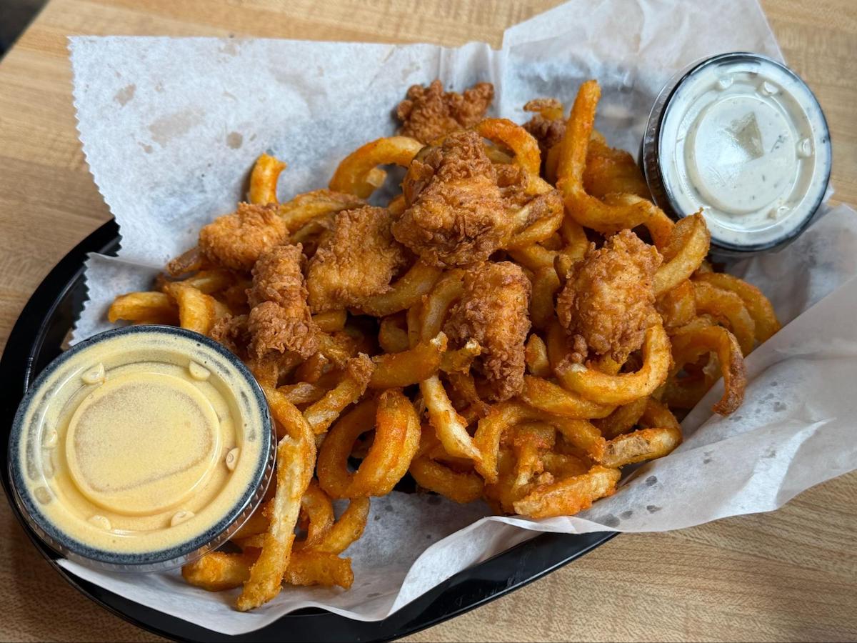 Popcorn chicken with curly fries at Bad Chicken. | Photo by Steven Craig Lindsey