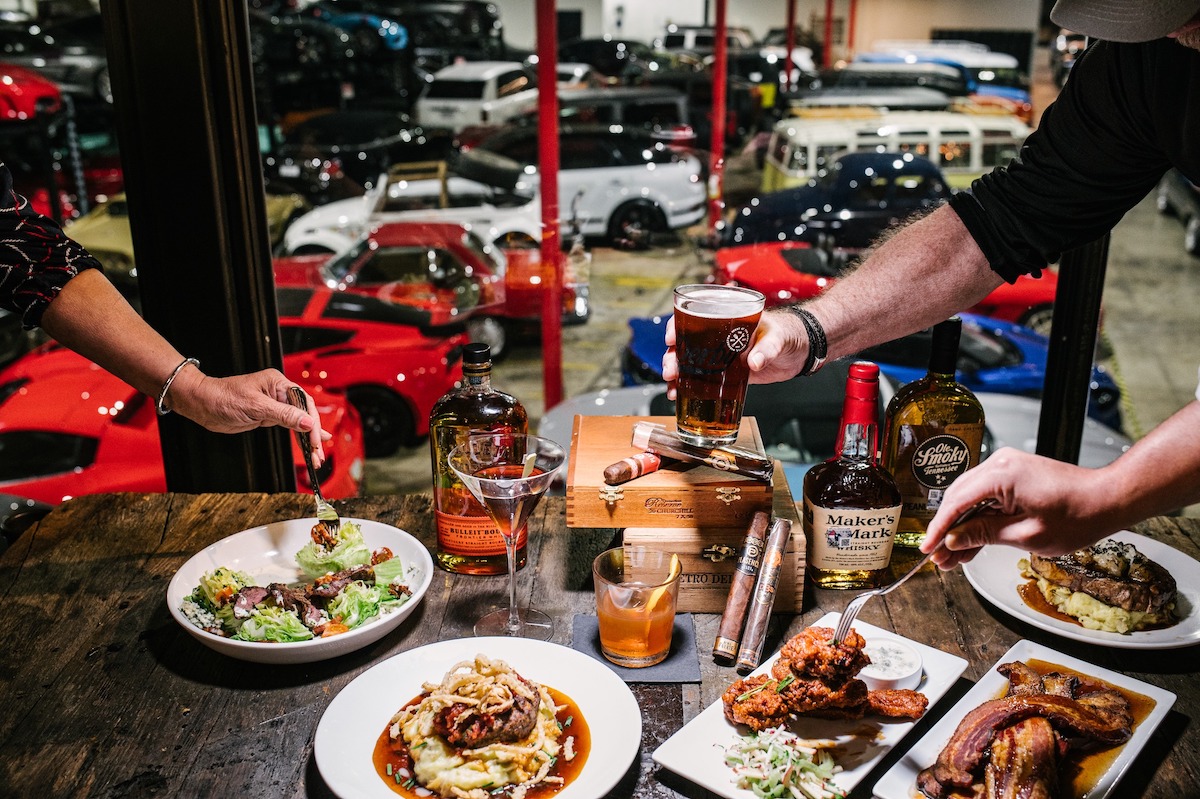 Derby - DiningOut Dining with a backdrop of the impressive showroom at Derby. | Photo by Derby Restaurant