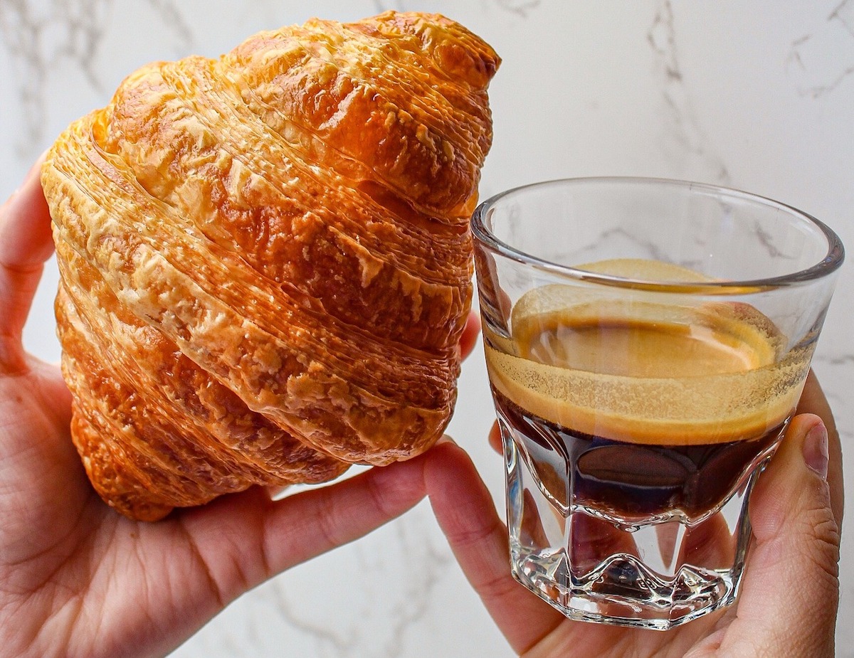 Eadough - DiningOut A buttery croissant with a shot of espresso at Eadough. | Photo by Eadough