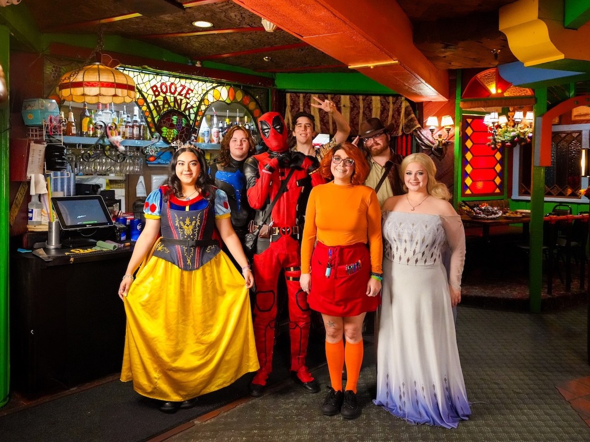 A waitstaff of characters await at the Magic Time Machine. | Photo by the Magic Time Machine