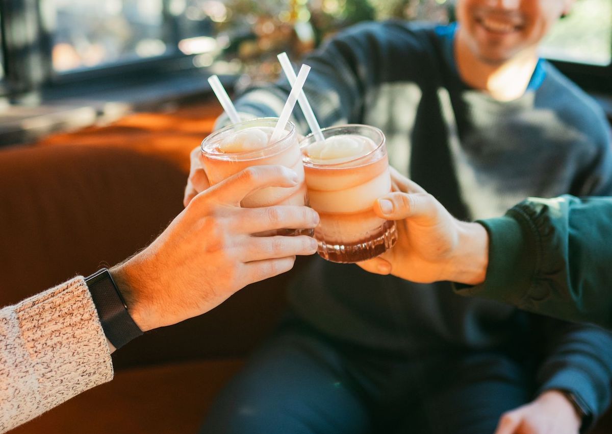 A group toasts with Mambo Taxis at Mi Cocina. | Photo by Mi Cocina