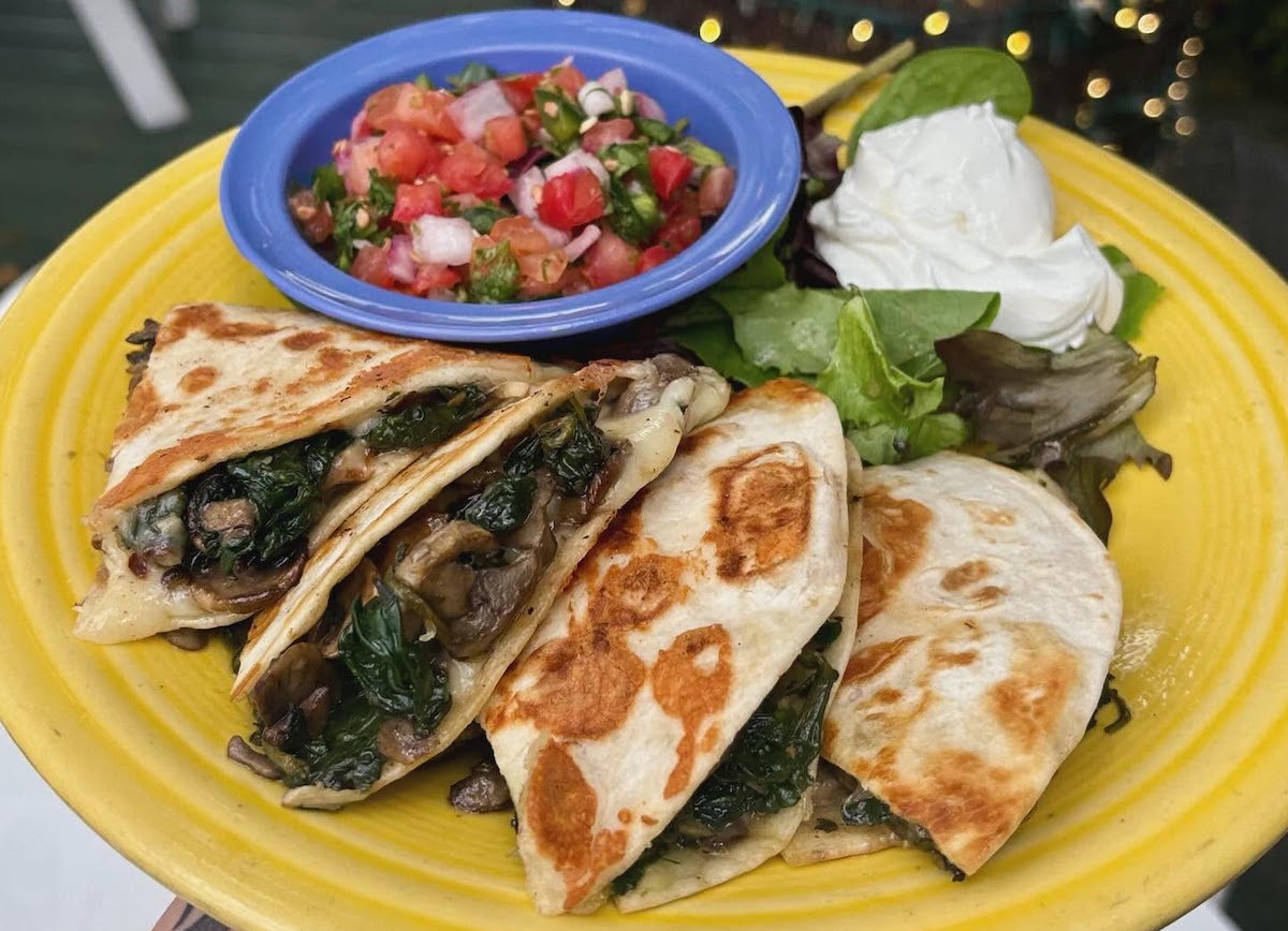 The wizard quesadilla at Hobbit Cafe packs spinach, sautéed mushrooms, and cheese into a grilled tortilla. | Photo by Hobbit Cafe