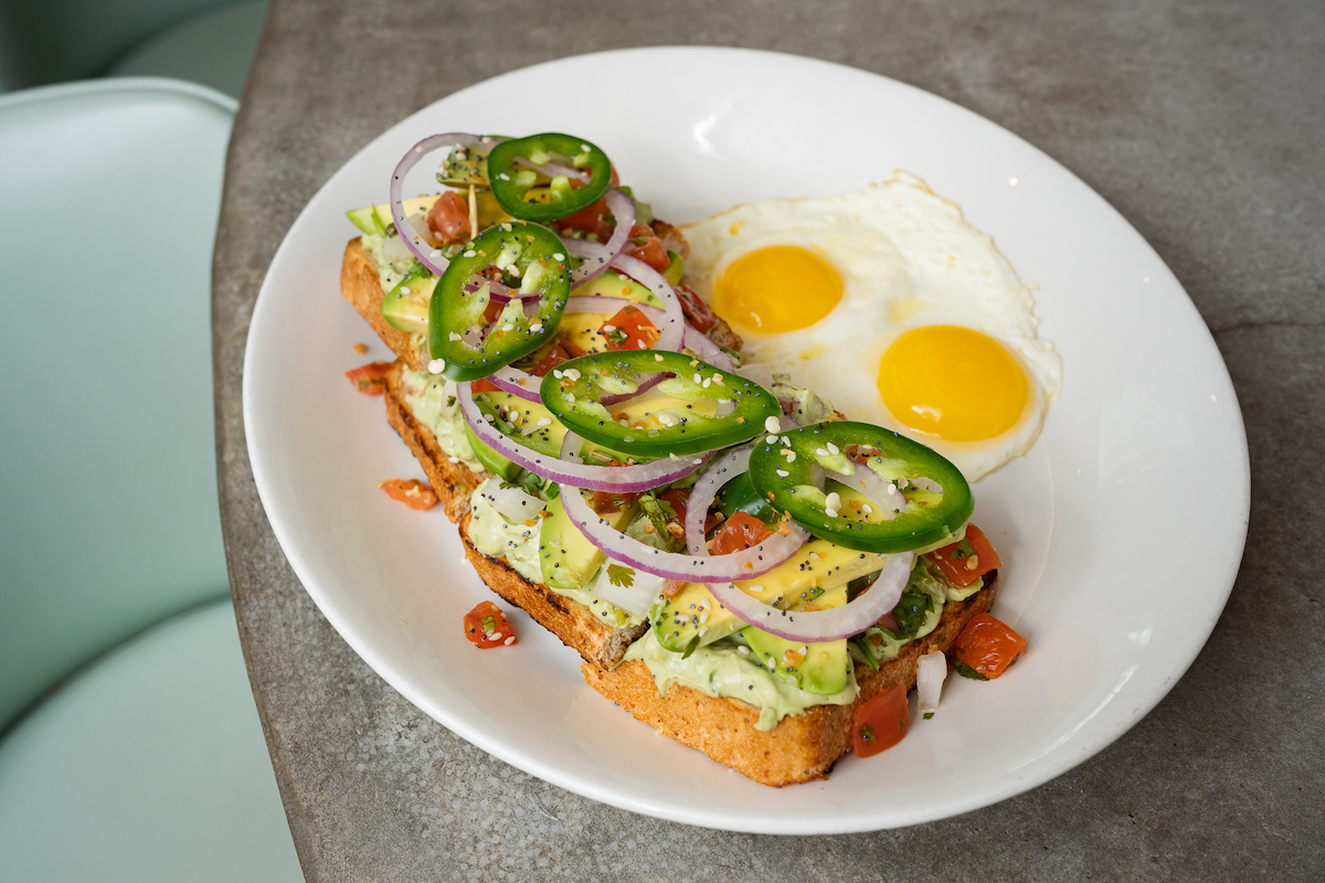 Avocado toast with sunny side up eggs at Katz. | Photo by Katz
