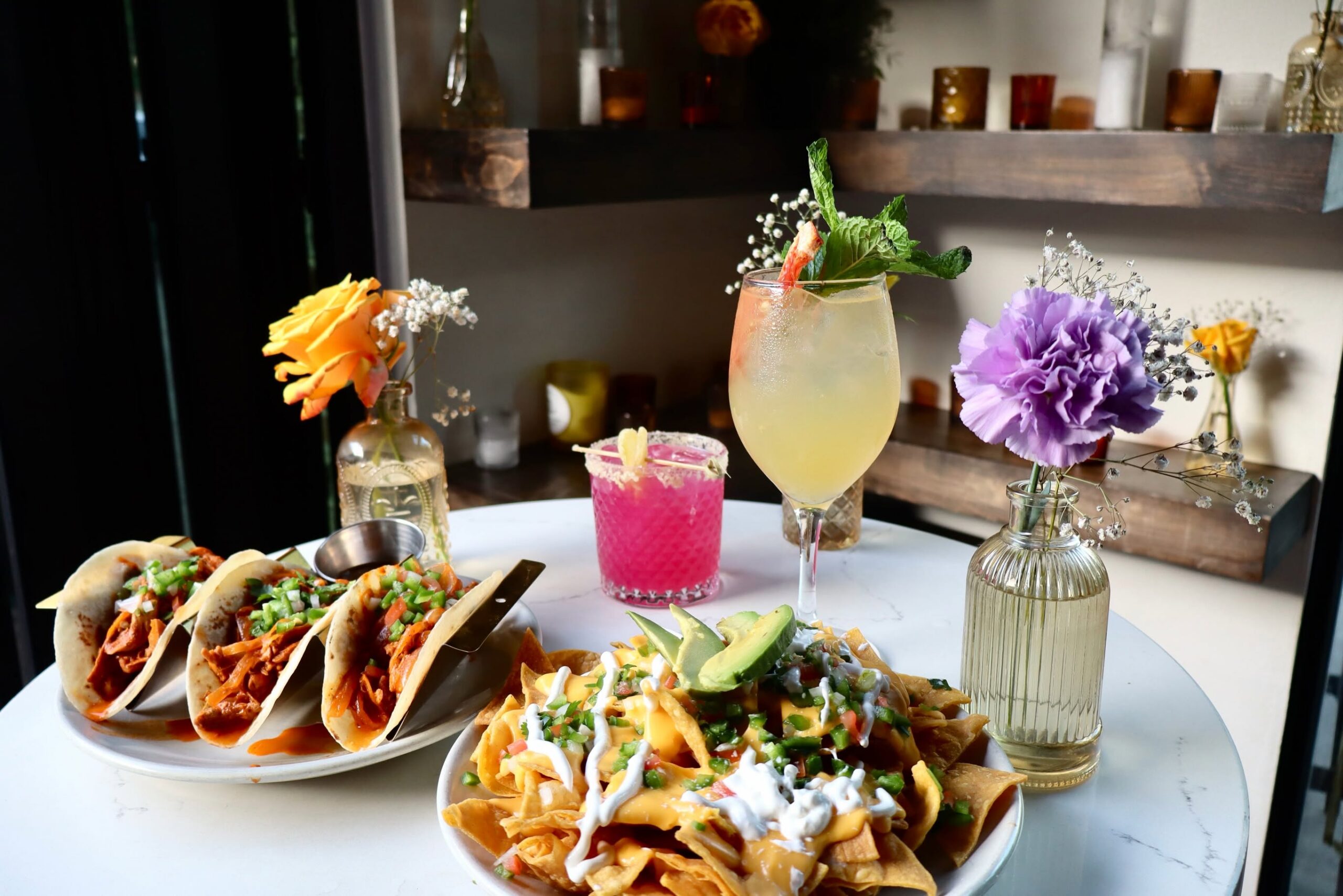 Tacos, loaded nachos and colorful cocktails set the table at La Reunion. | Photo by La Reunion
