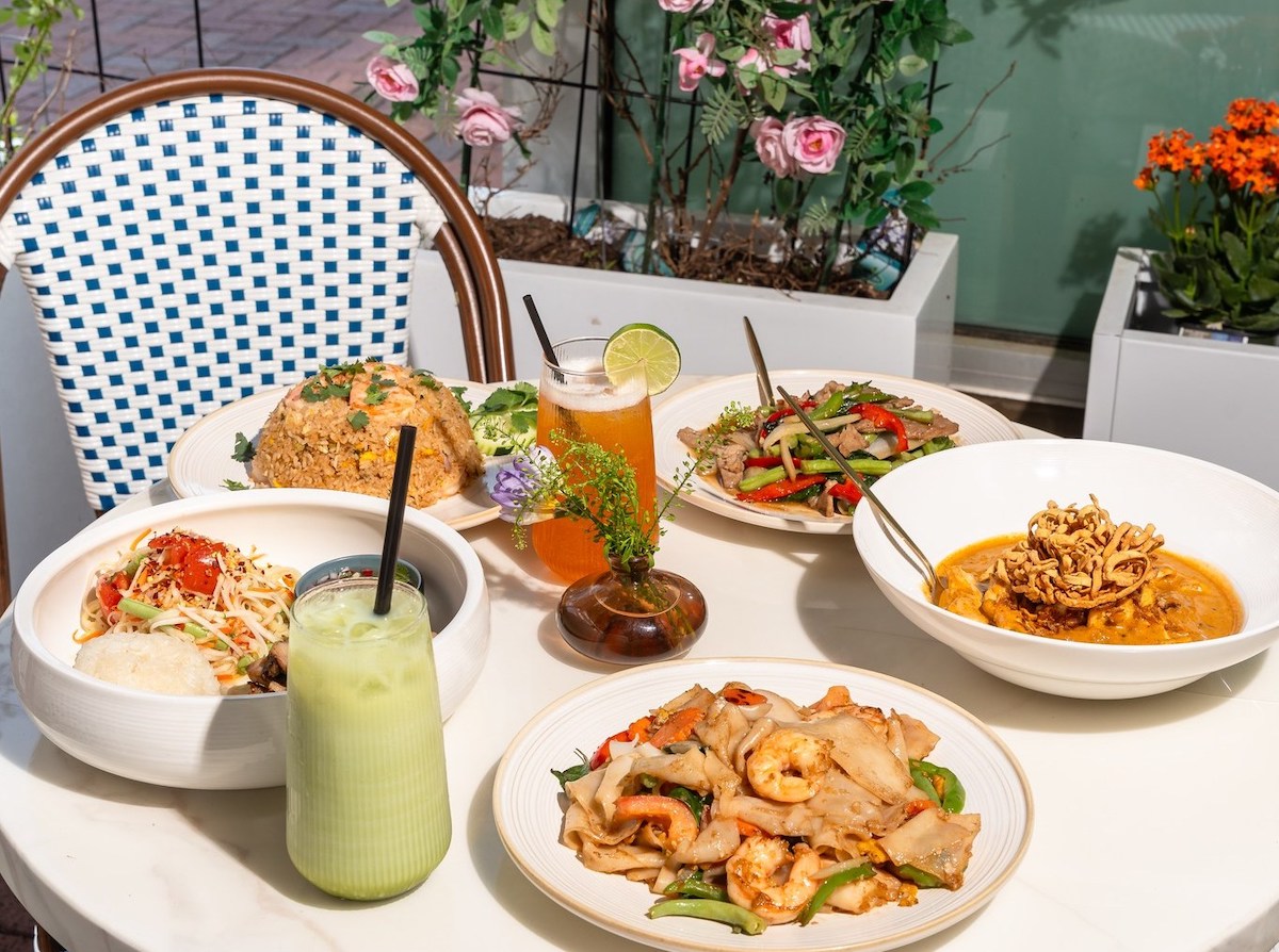 An assortment of dishes and drinks served on the patio at Thai's Thumbz in Sugar Land Town Square. | Photo by Thai's Thumbz