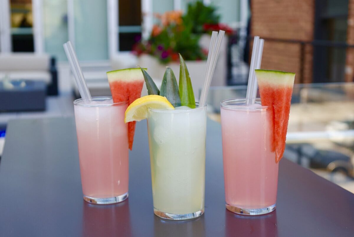 Woodie Fisher has a new rooftop that's perfect for enjoying its summer frozen cocktails: A non-alcoholic watermelon-lemonade sipper and a frozen peach bellini slushie. | Photo courtesy of Woodie Fisher