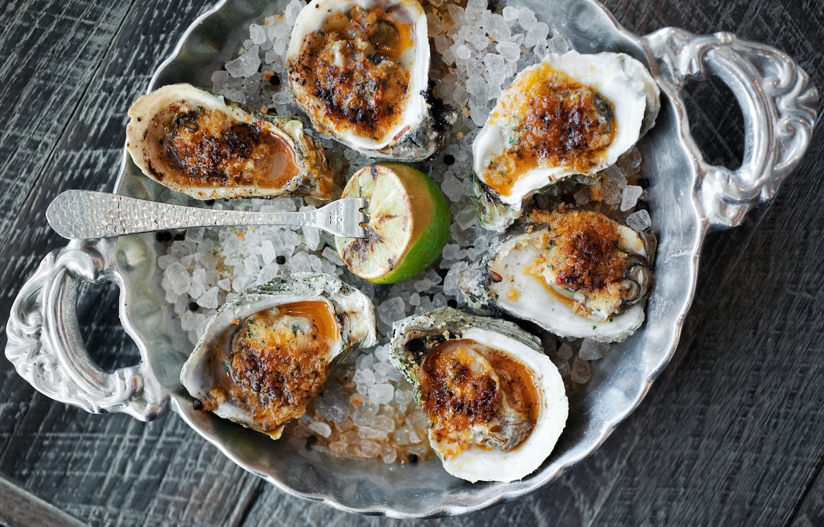 Wood-roasted oysters at Caracol. | Photo by Deb Smail