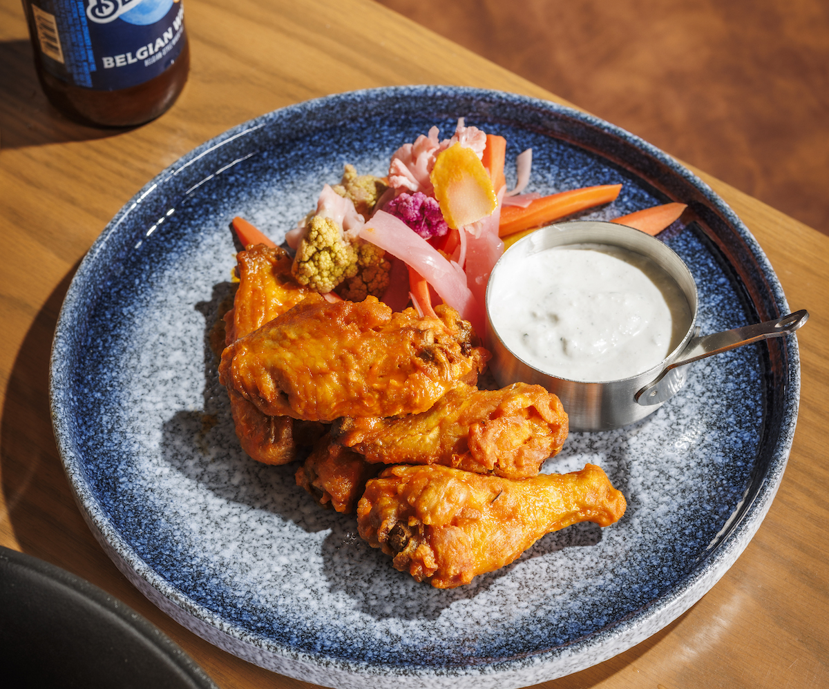 Victory Tap Sports Lounge serves classic Buffalo wings with house-made ranch. | Photo by S. Reynolds