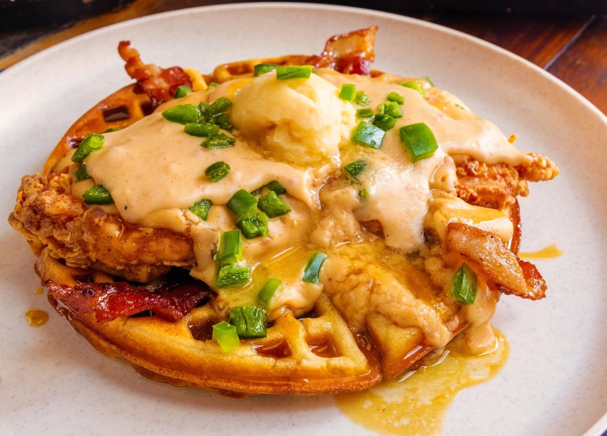 Brick & Bones - DiningOut Fried chicken atop a waffle at Brick & Bones. | Photo by Brick & Bones