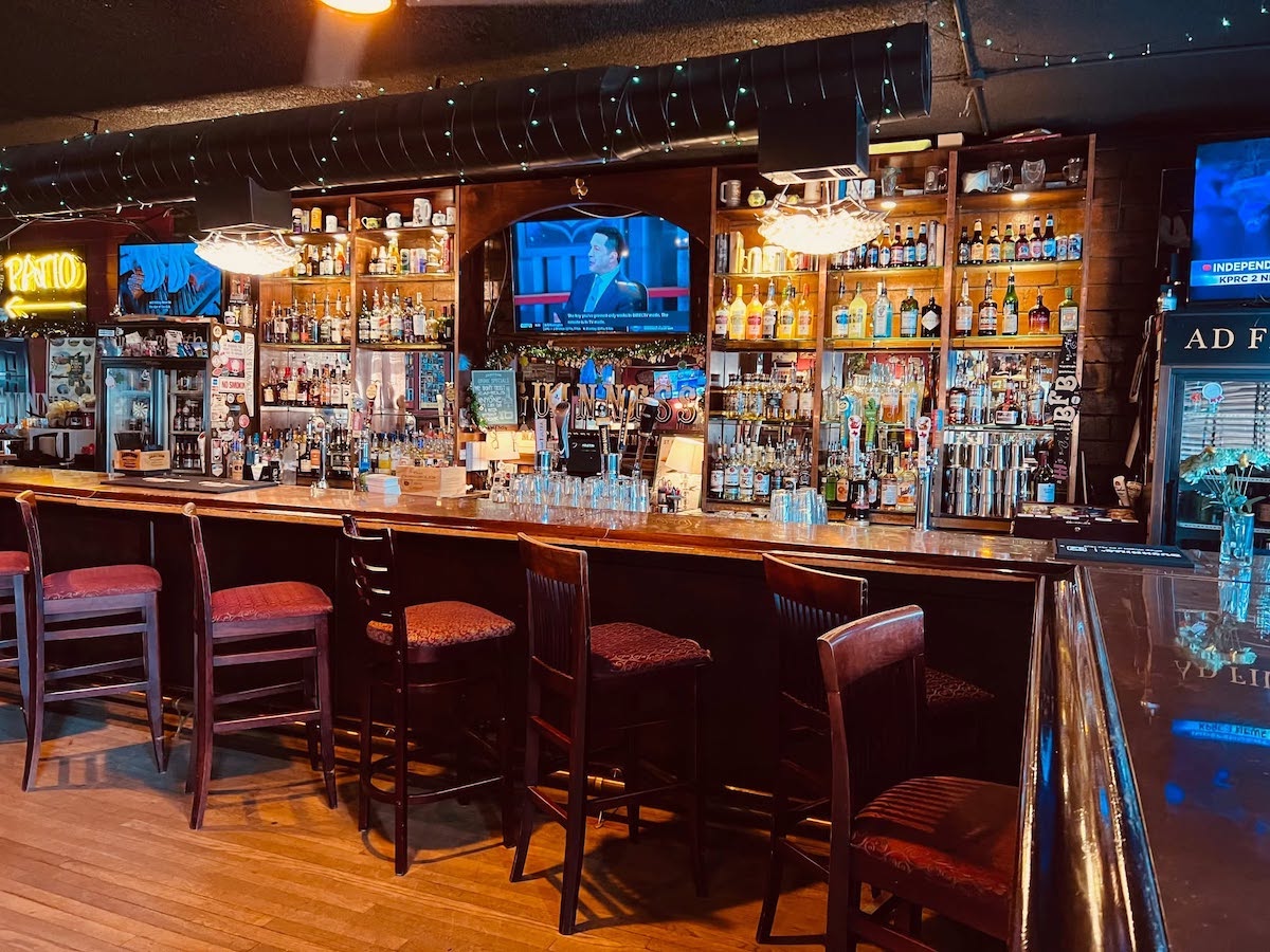 The spacious patio at Johnny McElroy’s offers picnic tables, plenty of TVs, and room to settle in with a pint. | Photo by Johnny McElroy’s