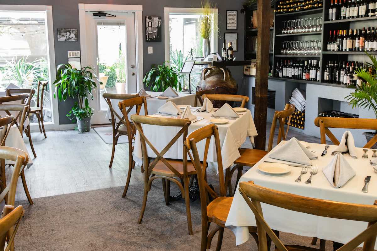 The cozy and rustic dining room at Roma. | Photo by Becca Wright